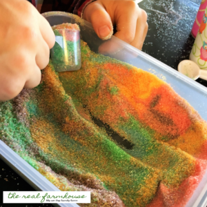 homemade edible play sand! All you need is pure cane sugar and feed coloring for loads of hands on fun!